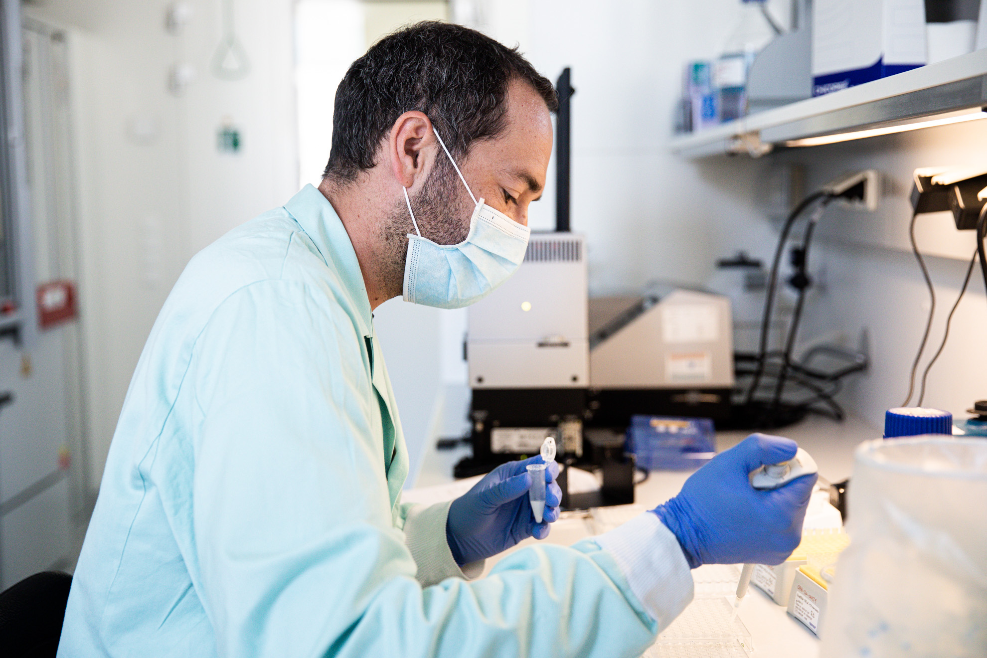 male lab technician analysing a sample